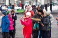 Holiday maslenitsa. Winter snow. Children with donuts. We are seeing winter. Children throw a broom