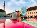 Cup of coffee and blue glass of wine on red table top , holiday in Tallinn ,street cafe  in  town hall square,bright sunny day in Royalty Free Stock Photo