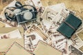 Holiday memories. Vintage postcards with a map, photo camera and travel notebook Royalty Free Stock Photo