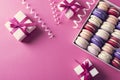 Holiday mood with gift boxes and colored sweet macaroons