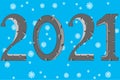 Holiday new year numerals 2021 on background snowflake