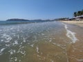 Holiday panorama of sandy beach at bay of ACAPULCO city in Mexico and waves of Pacific Ocean landscape Royalty Free Stock Photo