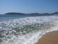 Holiday panorama of sandy beach at bay of ACAPULCO city in Mexico and white waves of Pacific Ocean landscape Royalty Free Stock Photo