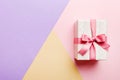 holiday paper present tied pink ribbon bow top view with copy space. Flat lay holiday background. Birthday or christmas Royalty Free Stock Photo