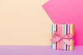 holiday paper present tied pink ribbon bow top view with copy space. Flat lay holiday background. Birthday or christmas Royalty Free Stock Photo