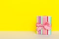 holiday paper present tied pink ribbon bow top view with copy space. Flat lay holiday background. Birthday or christmas Royalty Free Stock Photo