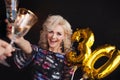 Holiday party, a beautiful young blonde woman drinking champagne Royalty Free Stock Photo