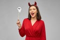 Happy woman in red halloween costume of devil Royalty Free Stock Photo