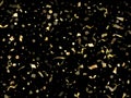 Holiday realistic gold confetti flying on black background. Royalty Free Stock Photo