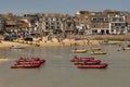 Holiday resort with red dinghies for rent. St Ives, UK