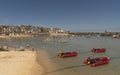 Holiday resort with red dinghies for rent. St Ives, UK