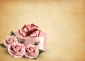 Holiday retro background with pink roses and gift