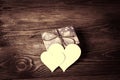 Holiday/romantic/wedding/valentine Day background with blank message card in the form of two hearts on wooden table