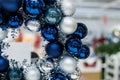 Holiday round frame, silver and blue glass Christmas balls, isolated on blurred background.Happy new year decoration for Royalty Free Stock Photo