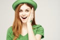 holiday Saint Patrick& x27;s Day shamrock girl fun Green clothing light background Royalty Free Stock Photo