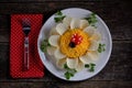 Holiday salad `Flower` with boiled eggs and chips. Christmas background