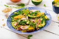 Holiday salad with smoked chicken, mango, avocado and arugula.