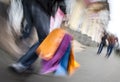 Holiday sales. An elderly man with many shopping bags in his han Royalty Free Stock Photo