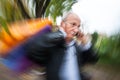 Holiday sales. An elderly man with many shopping bags in his han Royalty Free Stock Photo