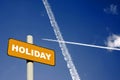 Holiday sign with jet trails in a dark blue sky Royalty Free Stock Photo