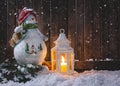 Holiday Snowman and Glowing Lantern