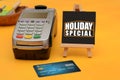 Holiday Special sale sign with credit card swipe machine
