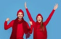 Holiday Spirit. Portrait Of Overjoyed Young Couple Wearing Winter Hats Celebrating Success Royalty Free Stock Photo