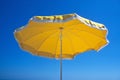 By the swimming pool with detail of yellow umbrella