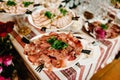 The holiday table with appetizer, meat snacks. Served table with food. Festive table. Wedding table, food. Table at restaurant Royalty Free Stock Photo