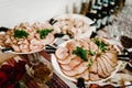 The holiday table with appetizer, meat snacks. Served table with food. Festive table. Wedding table, food. Table at restaurant Royalty Free Stock Photo