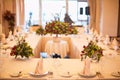 Holiday table setting in white and gold color