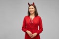 Happy woman in red halloween costume of devil Royalty Free Stock Photo