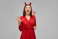 Scary woman in red halloween costume of devil Royalty Free Stock Photo