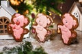 Holiday traditional food bakery. Three Gingerbread funny piggy in cozy warm decoration with garland lights