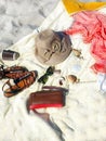 Holiday  Travel Beach Girl clothes Relaxation   Summer beach red dress hat with blue scarf and blue hand bag on sand seascape sk Royalty Free Stock Photo