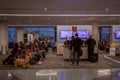 Holiday travelers waiting for a flight in Los Angeles Royalty Free Stock Photo