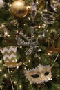 Christmas tree with branches covered in Mardi Gras theme Royalty Free Stock Photo