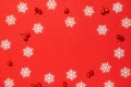 Holiday winter background. White snowflakes, red berry in Christmas composition on red background for greeting card. Xmas backdrop Royalty Free Stock Photo