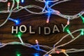 Holiday word with led lamp garland Royalty Free Stock Photo