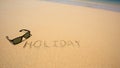 Holiday written in the sand at the beach waves in the background Royalty Free Stock Photo