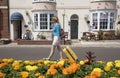 Holidaymaker walking with yellow suitcase Royalty Free Stock Photo