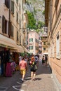 Holidaymakers in an alley of the popular old town of Limone Sul Garda in Italy