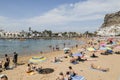 Holidaymakers on beach at Puero de Mogan on Gran Canaria. Royalty Free Stock Photo