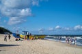 Holidaymakers and fishing boats on the beach of Rewal