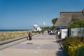 Holidaymakers on the popular pier of KÃ¼hlungsborn on the Baltic Sea coast in Germany