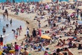 Holidaymakers sunbathe on the beach