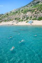 Holidaymakers swim to Tsambika beach RHODES, GREECE Royalty Free Stock Photo