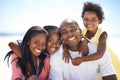 Holidays bring the family closer. An african-american family enjoying a day at the beach together. Royalty Free Stock Photo