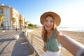 Holidays in Calabria. Selfie girl on Crotone promenade in Calabria, southern Italy