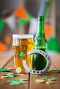 Glass of green beer, horseshoe and gold coins Royalty Free Stock Photo